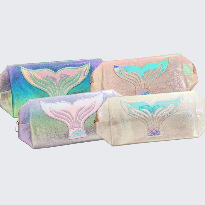 Iridescent whale-themed cosmetic pouches in pastel colors, perfect for makeup and accessories.