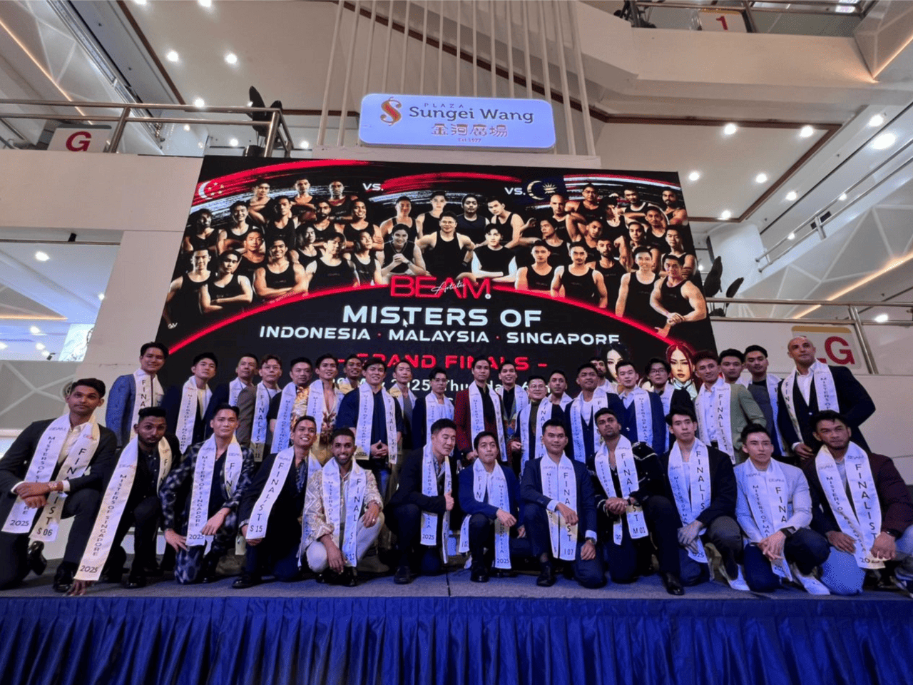 Group photo of winners at the Alluora sponsored Mister of Indonesia, Malaysia, Singapore beauty pageant event at Sungei Wang Plaza.