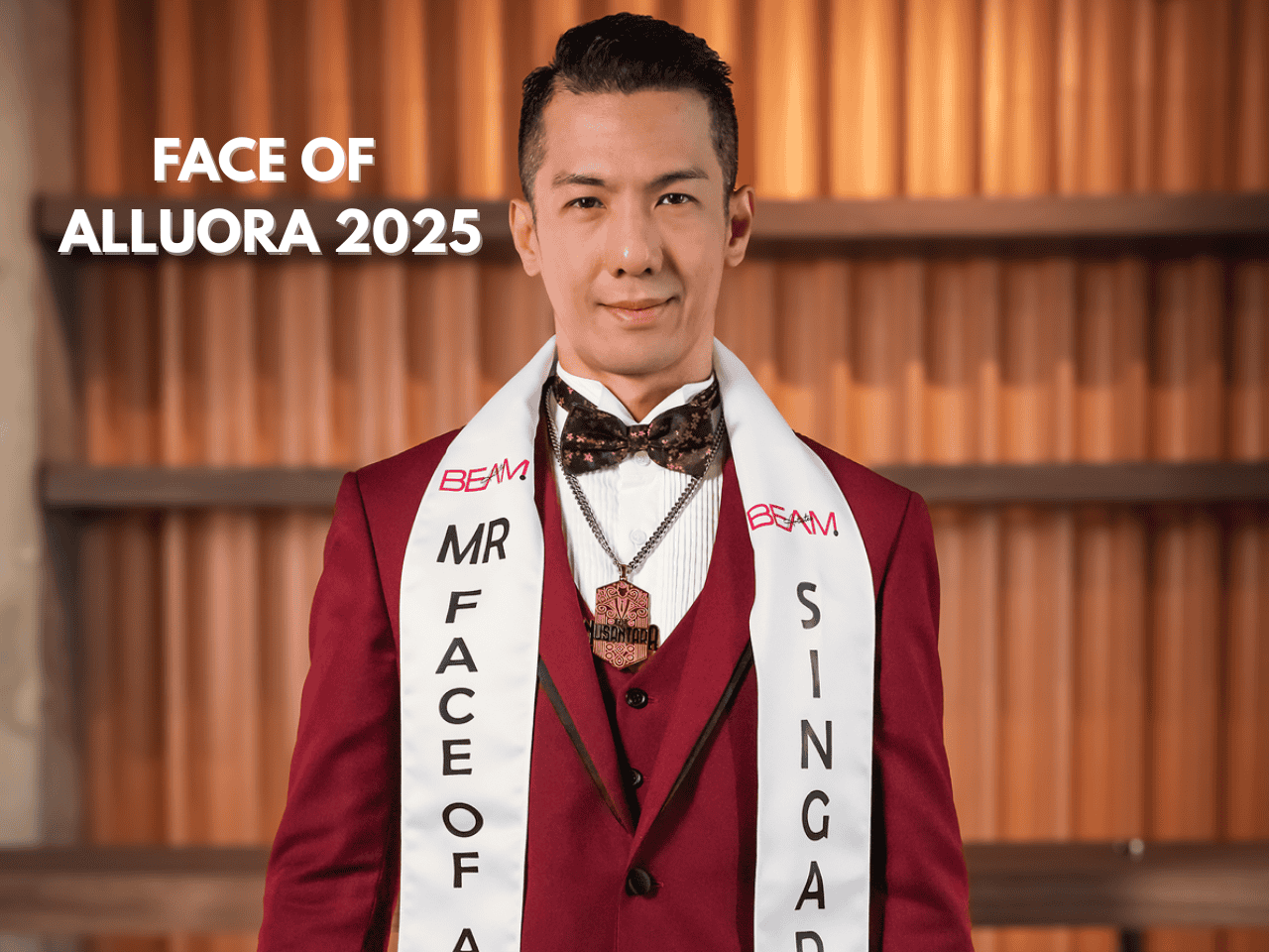 Young man in formal wear with sash that reads 